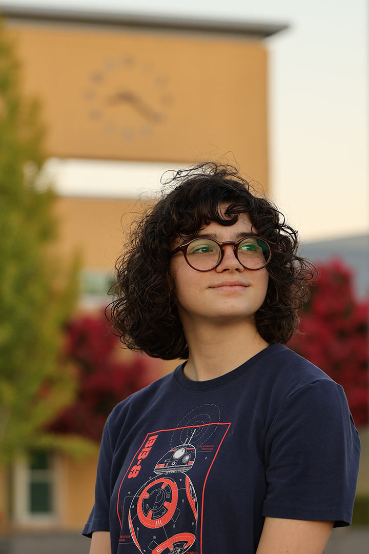 Student in front of the high school.