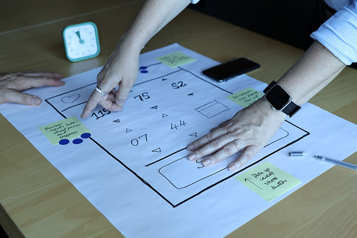 Creative Nights researcher discussion about the mobile app prototype.